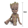 Image of disney Marvel Avengers Groot Mini figure Pen Holder  Flower Pot Anime Toys Action Figure Sitting Groot Christmas Kids Toys Gifts Shopping