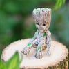 Image of disney Marvel Avengers Groot Mini figure Pen Holder  Flower Pot Anime Toys Action Figure Sitting Groot Christmas Kids Toys Gifts Shopping